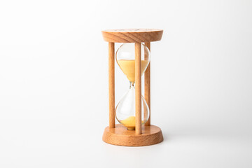 Wooden hourglass on a white background. Time concept