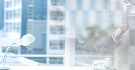 Composition of businessman talking in office over modern office building