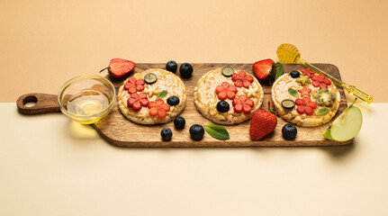 sandwiches peanut butter with fruits, berries with honey on a wooden board, top view. Banner Healthy tasty breakfast.