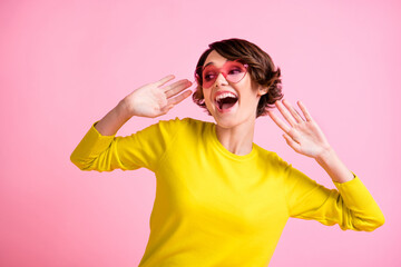 Photo portrait of happy girl dancing at party in glasses funky curious laughing isolated on pastel pink color background