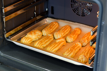 Baking eclairs in the oven.