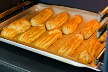 Baking eclairs in the oven.