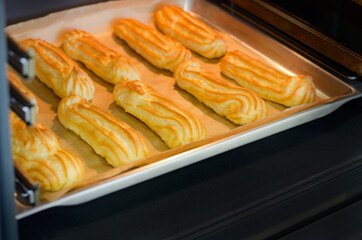 Baking eclairs in the oven.