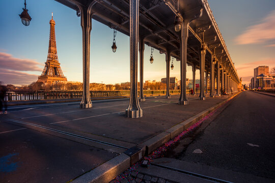 Paris, France - May 10, 2021: Eiffel Tower from Bir-Hakeim metal bridge at sunset in Paris