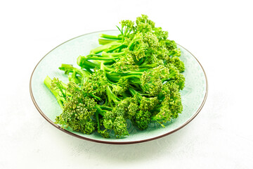 Fototapeta premium Organic Broccolini (bimi) in bowl on white background