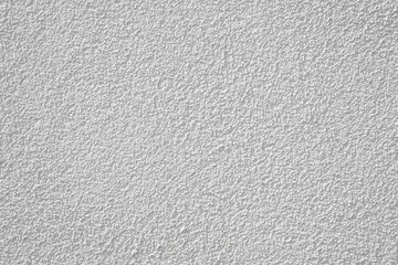 Decorative plaster with a granular structure. White textured wall background