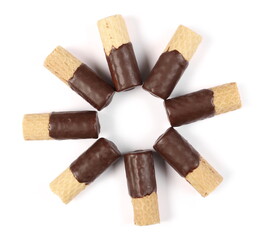 Waffle rolls partially covered with chocolate isolated on white background, top view