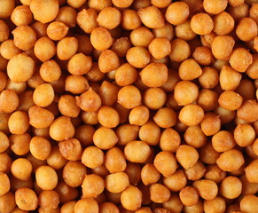 Salty fried crispy wheat pastry balls for soup background and texture