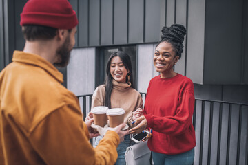 Three friends having coffee and feeling great together