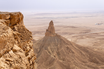The Faisal's Finger rock near Riyadh, Saudi Arabia, a view from Jabal Tuwaiq escarpment.