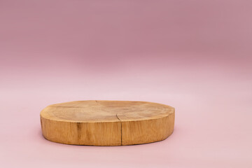 Wood podium on pink background for product presentation