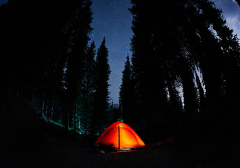 Glowing tent camping in the Night Mountains
