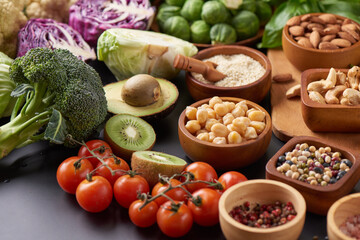 Different vegetables, seeds and fruits on table. Healthy diet..vegetarian, vegan food cooking ingredients. Flat-lay of vegetables, fruit, beans, cereals, kitchen utencil, dried flowers, top view.