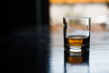 Whisky glass on a wooden surface