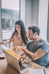 Colleagues working in the office and looking involved