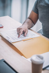 Close up of a man checking the documents