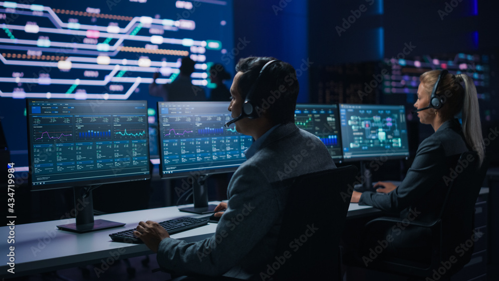 Poster Team of Professional Traders Talking into Headsets Work on Computers with Screen Showing Finance Statistics, Charts Strategy, Stock, Telemarketing. Stock Firm Monitoring Room Stock Market Specialists