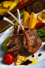 Lamb chops marinated in herbs with green asparagus and lime