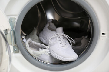Clean sports shoes in washing machine drum