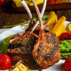 Lamb chops marinated in herbs with green asparagus and lime
