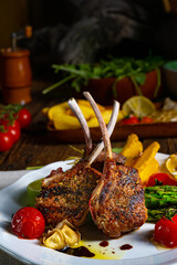 Lamb chops marinated in herbs with green asparagus and lime