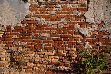 Concrete wall and bricks texture of old railway warehouse.
