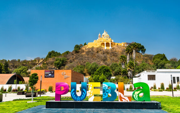 Sign Puebla and the Church of Our Lady of Remedies, Mexico