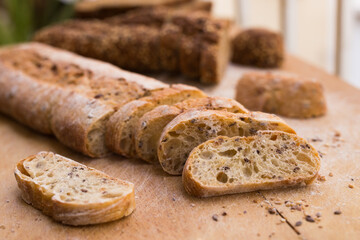 fresh loaf of bread on wooden board