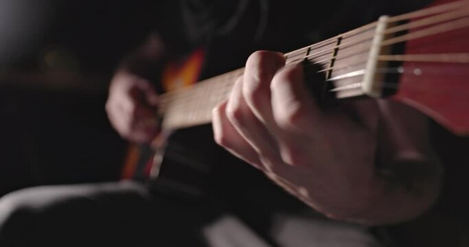 Playing on the guitar closeup footage