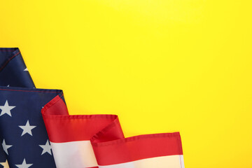 American flag on yellow background with copy space