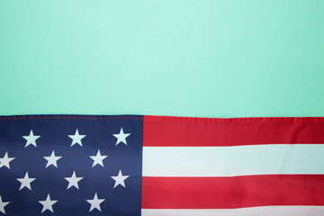 American flag on mint background with copy space