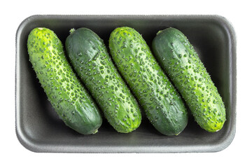 Four cucumbers in the black plastic container isolated on white
