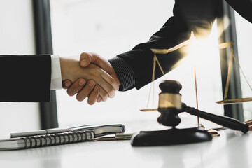 Businessman shaking hands to seal a deal Judges male lawyers Consultation legal services Consulting in regard to the various contracts to plan the case in court