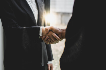 businessman handshake for teamwork of business merger and acquisition