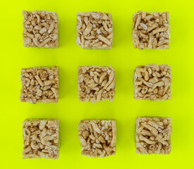 Khao Soi dessert background, cut squares placed on green background.