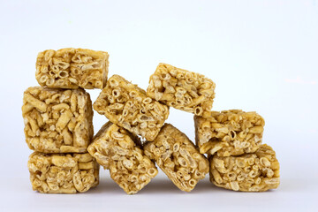 Isolates a pile of kao Soi desserts, cut many squares.