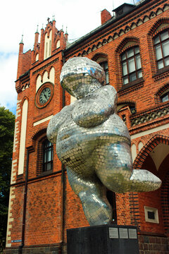 Riga, Latvia - July 10, 2017: Venus of Willendorf by Brigita Zelca in front of The Art Academy of Latvia. Modern replica of the Stone Age masterpiece made of glued foam rubber and mirrored plastic.
