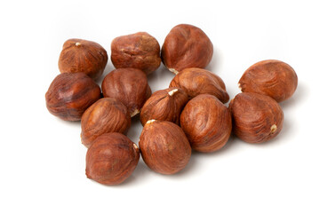 Fototapeta premium Close-up of hazelnut kernels on a white background.