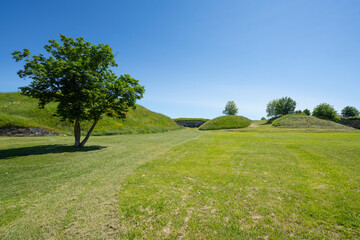  the ancient ramparts of the fortifications and the moat that surrounds the city