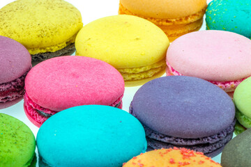 Fototapeta na wymiar Colorful macarons on white background. Macaron or Macaroon is sweet meringue-based confection.