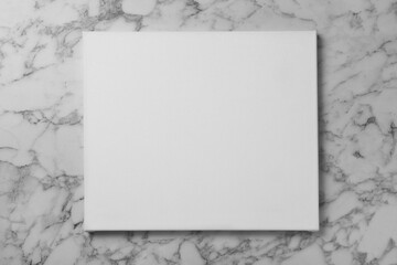 Blank canvas on white marble background, space for text