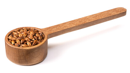 Barley Tea in the wooden spoon, isolated on pure white background