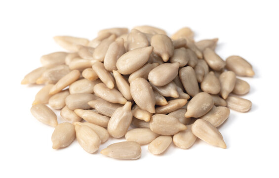 pile of peeled sunflower seeds isolated on white background