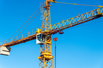 Construction crane in a blue sky