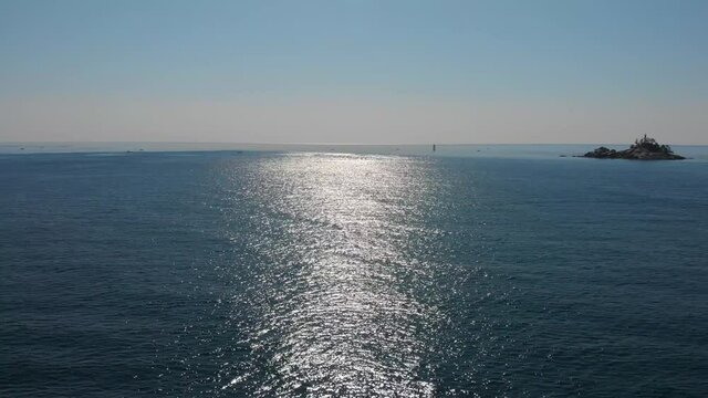 Sea surface is glittering reflects sun lights. Beautiful nature aerial drone footage took with 4K 30fps.