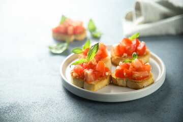 Traditional homemade bruschetta with tomato and basil