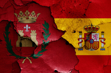 flags of Elda and Spain painted on cracked wall
