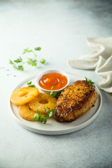 Grilled turkey with pineapple and mango sauce
