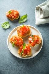 Traditional homemade bruschetta with tomato and basil