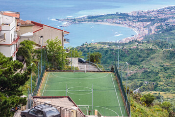 Street and sport field in Castelmola town on Sicily Island, Italy